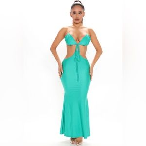 Green dress with gold straps.